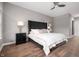 Tranquil main bedroom featuring a luxury bed, modern lighting, and wood grain floors at 435 Virginia Ave # 101, Indianapolis, IN 46203