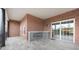 Covered patio with brick accents, outdoor fireplace, and sliding glass doors for easy outdoor living at 435 Virginia Ave # 101, Indianapolis, IN 46203