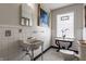 Charming bathroom with classic tile, pedestal sink, and decorative accents at 5165 E Pleasant Run Pkwy S Dr, Indianapolis, IN 46219
