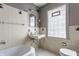 Well-maintained bathroom with vintage tile, ample natural light, and classic fixtures at 5165 E Pleasant Run Pkwy S Dr, Indianapolis, IN 46219