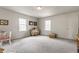 Spacious bedroom with neutral decor, natural light, ample closet space, and plush carpeting at 5165 E Pleasant Run Pkwy S Dr, Indianapolis, IN 46219