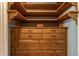 Organized closet space with wooden shelving and storage drawers for optimal functionality at 5165 E Pleasant Run Pkwy S Dr, Indianapolis, IN 46219
