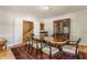 Spacious dining room with wood floors, hutch, and natural light at 5165 E Pleasant Run Pkwy S Dr, Indianapolis, IN 46219