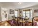Formal dining room with elegant table set, bay window, and natural light at 5165 E Pleasant Run Pkwy S Dr, Indianapolis, IN 46219