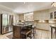 Spacious kitchen with stainless steel appliances, center island, and custom backsplash at 5165 E Pleasant Run Pkwy S Dr, Indianapolis, IN 46219