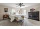 Comfortable bedroom boasts natural light, patterned carpet, ample storage, and bench seating at 5165 E Pleasant Run Pkwy S Dr, Indianapolis, IN 46219