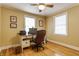 Bright home office with wood floors, natural light, and built-in shelving for an efficient workspace at 5165 E Pleasant Run Pkwy S Dr, Indianapolis, IN 46219