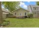 Well-maintained backyard featuring a patio with outdoor seating and a grill, perfect for entertaining at 5259 Broadway St, Indianapolis, IN 46220