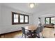 Bright dining room featuring hardwood floors, modern lighting, and a neutral color scheme at 5259 Broadway St, Indianapolis, IN 46220