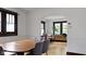 Elegant dining room with hardwood floors, a stylish chandelier, and an arched doorway at 5259 Broadway St, Indianapolis, IN 46220
