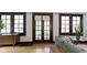 Inviting living room with beautiful hardwood floors, wooden trim, and natural light at 5259 Broadway St, Indianapolis, IN 46220