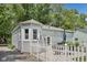 Charming backyard with a white picket fence and outdoor seating area at 5333 Ralston Ave, Indianapolis, IN 46220