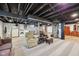 Finished basement with laundry, a cozy seating area, and unfinished elements at 5333 Ralston Ave, Indianapolis, IN 46220