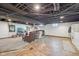 Spacious basement with painted ceilings, a lounging area and an unfinished floor at 5333 Ralston Ave, Indianapolis, IN 46220