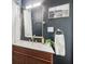 Contemporary bathroom features modern vanity with a gold mirror and a stylish decor at 5333 Ralston Ave, Indianapolis, IN 46220