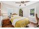 Cozy bedroom features hardwood floors, natural light, and a warm color scheme at 5333 Ralston Ave, Indianapolis, IN 46220