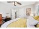 Bright bedroom featuring a comfortable bed, fan, and personal touches at 5333 Ralston Ave, Indianapolis, IN 46220