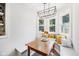Comfortable dining nook featuring built-in benches, a wooden table, and decorative pillows at 5333 Ralston Ave, Indianapolis, IN 46220
