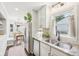 Kitchen area features stainless steel appliances, granite countertops, and an adjacent dining nook at 5333 Ralston Ave, Indianapolis, IN 46220