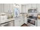 Bright and clean kitchen with white subway tile, stainless steel appliances, and granite countertops at 5333 Ralston Ave, Indianapolis, IN 46220