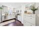 Well-lit kitchen with white cabinetry, stainless steel appliances, and granite countertops at 5333 Ralston Ave, Indianapolis, IN 46220