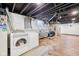 Basement laundry area with a modern washer, dryer, and sink at 5333 Ralston Ave, Indianapolis, IN 46220