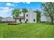 View of the backyard showcasing a wooden deck and lush green space perfect for outdoor activities at 5369 Red River Ct, Indianapolis, IN 46221