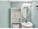 Well-lit bathroom with modern fixtures and under sink storage cabinet at 5369 Red River Ct, Indianapolis, IN 46221