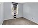 A bright bedroom with large window and neutral carpet at 5369 Red River Ct, Indianapolis, IN 46221