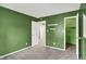 Spacious bedroom featuring neutral carpet, closet and dual white floating shelves at 5369 Red River Ct, Indianapolis, IN 46221