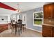 View of dining area, open to the kitchen, featuring modern table and chairs set at 5369 Red River Ct, Indianapolis, IN 46221