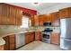 Updated kitchen with stainless steel appliances, ample counter space, and custom cabinetry at 5369 Red River Ct, Indianapolis, IN 46221
