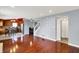 Spacious open concept living room shows layout to dining area and hardwood floors at 5369 Red River Ct, Indianapolis, IN 46221