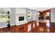 Comfortable living room with brick fireplace and view into adjacent kitchen at 5369 Red River Ct, Indianapolis, IN 46221