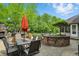 Outdoor dining area, stone bar with grill, and koi pond highlight outdoor space at 5419 Cayman Dr, Carmel, IN 46033