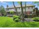 Picturesque backyard view highlighting the lush landscaping, outdoor patio, and well-maintained lawn at 5419 Cayman Dr, Carmel, IN 46033