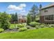 Well-manicured yard with decorative statues, manicured plants, and a partial view of the home at 5419 Cayman Dr, Carmel, IN 46033
