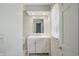 Bright bathroom vanity with a white cabinet, sink, and window providing natural light at 5419 Cayman Dr, Carmel, IN 46033