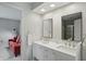 Bright bathroom with a double vanity and mirrors at 5419 Cayman Dr, Carmel, IN 46033