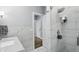 Bathroom with a marble countertop, shower and white tiled walls at 5419 Cayman Dr, Carmel, IN 46033