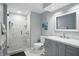 Modern bathroom features a stylish vanity, marble countertop, and glass enclosed shower at 5419 Cayman Dr, Carmel, IN 46033