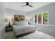 Bedroom with a bed, bedside tables and a window that looks to the yard at 5419 Cayman Dr, Carmel, IN 46033