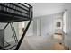 Bedroom boasts a loft bed, neutral carpet, and adjacent bathroom at 5419 Cayman Dr, Carmel, IN 46033