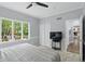 Bedroom with a bed, TV, closet and a window that looks to the yard at 5419 Cayman Dr, Carmel, IN 46033