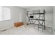 Cozy bedroom featuring a unique loft bed with study space underneath and natural light at 5419 Cayman Dr, Carmel, IN 46033