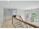 Bright foyer features a charming chandelier and staircase with light-colored walls and carpeted floors at 5419 Cayman Dr, Carmel, IN 46033