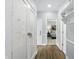 Hallway view with a pantry, closet, and an open door to a bedroom at 5419 Cayman Dr, Carmel, IN 46033