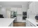 Stainless steel appliances, double ovens, and crisp white cabinetry create a modern kitchen at 5419 Cayman Dr, Carmel, IN 46033