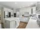 Spacious kitchen with a center island, stainless steel appliances, and white cabinetry at 5419 Cayman Dr, Carmel, IN 46033