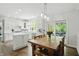 Updated kitchen featuring custom white cabinets, stainless appliances, and modern pendant lighting at 5419 Cayman Dr, Carmel, IN 46033